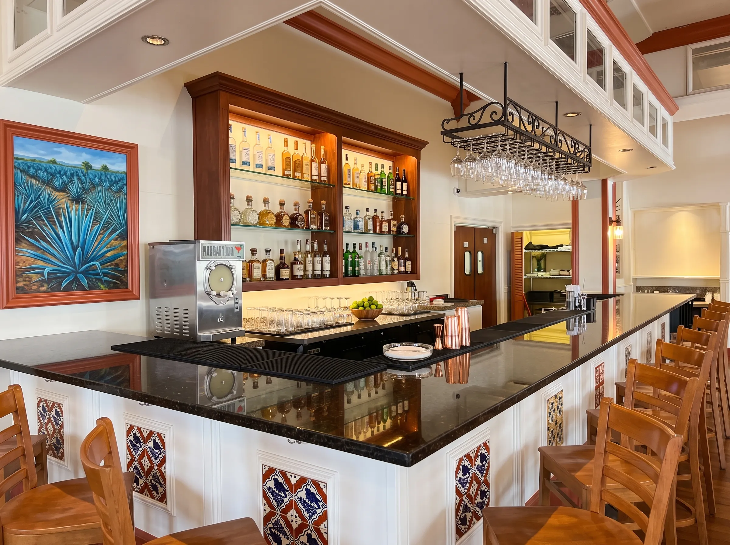 Panfila’s finished cantina with agave spirits, Mexican liqueurs, glassware and hand-painted tile details